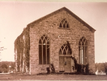 Sepia toned photo of historic stone church