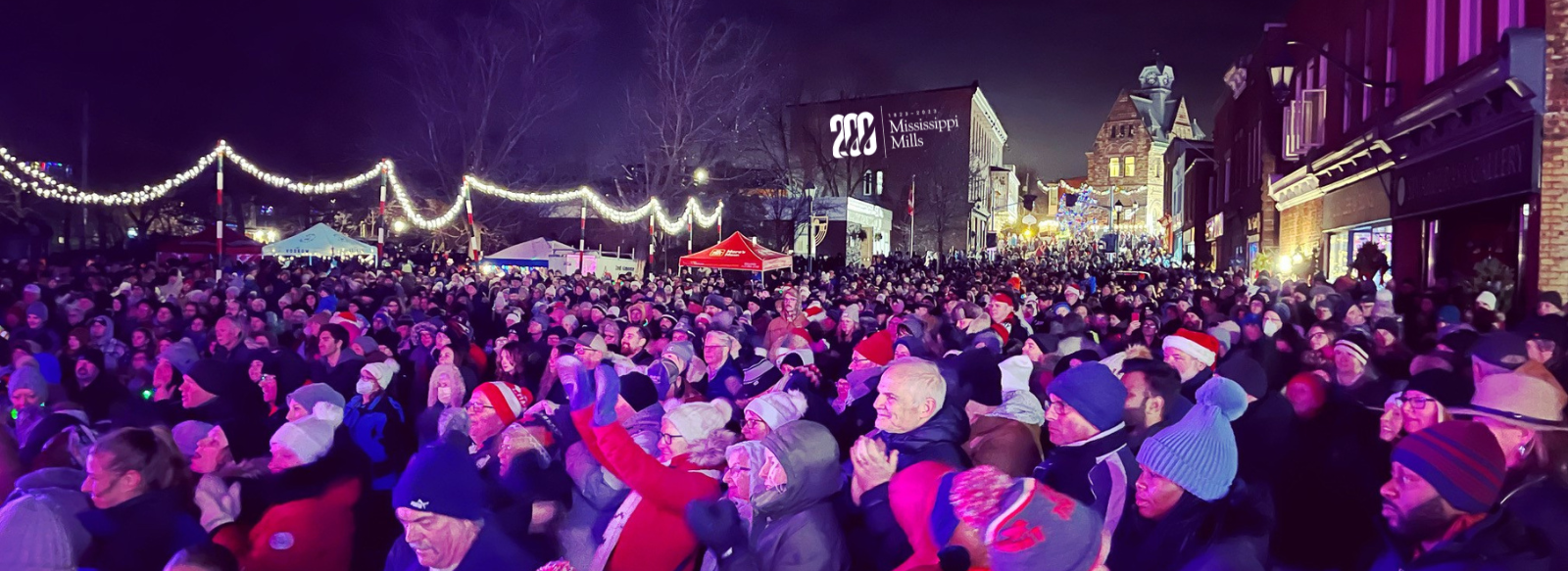 Photo of crowded Mill Street at night during Light Up the Night