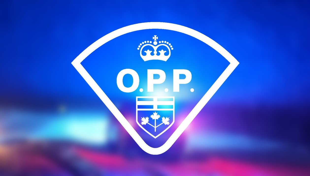 Ontario Provincial Police logo with a police car and flashing lights in the background