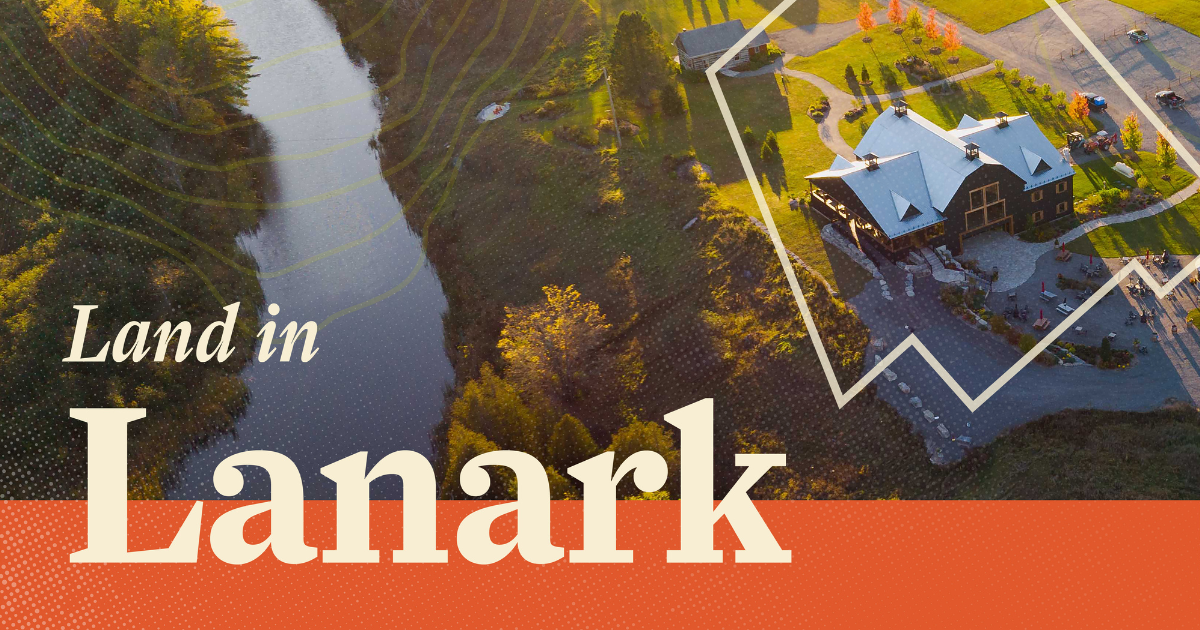 Aerial photo of rural countryside with river flowing through it and the text 'Land in Lanark'