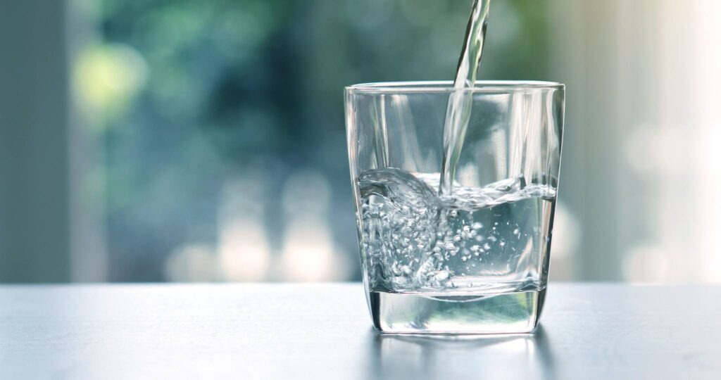 Water being poured into clear glass