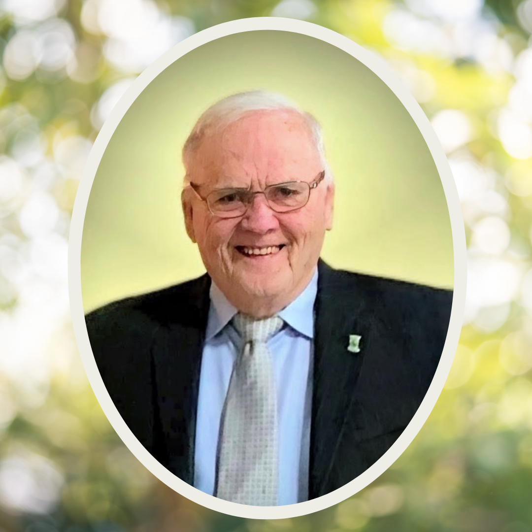 Green and yellow graphic featuring a circular photo of an older white man in a suit smiling