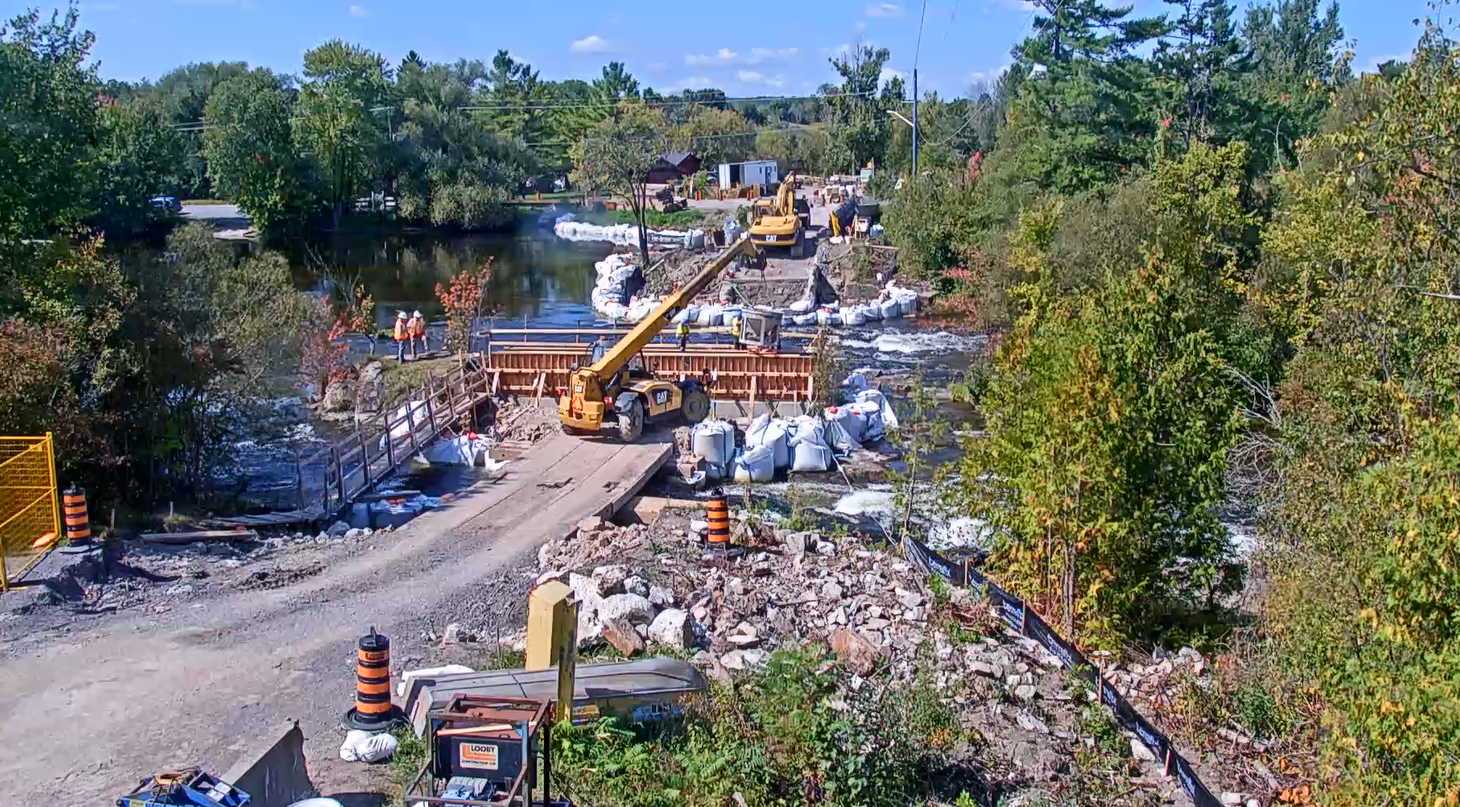 Photo showing construction crews working on a bridge